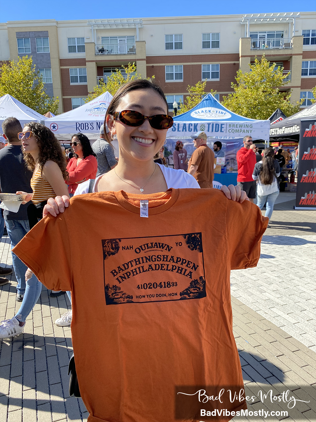 Ouija board with Philadelphia vibes. "Ouijawn" t-shirt made by Bad Vibes Mostly at 2022 Glassboro Craft Beer Festival. Bad things happen in Philadelphia. How you doin, hon?